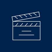 A blue and white icon of a director's slate