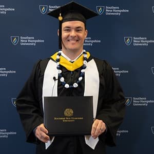 Andrew Reil, a 2024 bachelor's in business administration graduate from SNHU