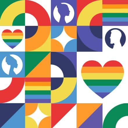 Several rainbow colored heart, icons, flags and silhouettes representing Pride Month