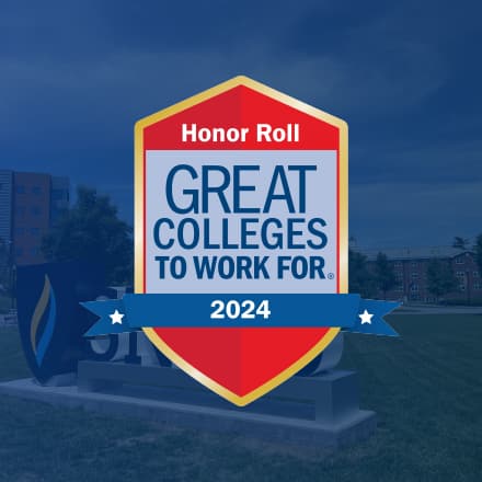 The 2024 Great Colleges to Work For badge with an image of SNHU's campus overlayed in blue behind it.