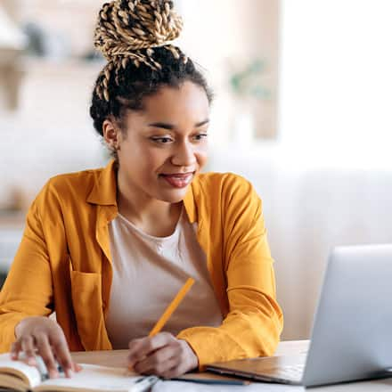 A college student completing work in her online college course