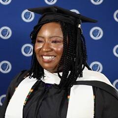 Adanze Chukwuocha '23G, SNHU master's in English and creative writing graduate, in a cap and gown.