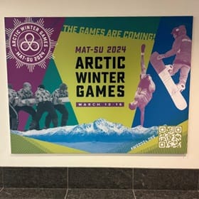 A sign advertising the Arctic Winter Games that SNHU alumna Chris King participated in for Global Days of Service