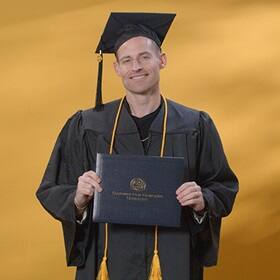 Philip Hensarling, a 2024 graduate from SNHU with a bachelor's in healthcare administration.