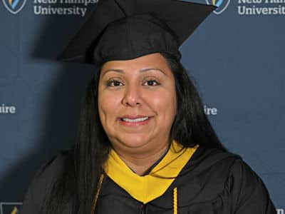 Susana Ashooh, who earned her bachelor's in nursing from SNHU in 2023, wearing her graduation cap and gown.