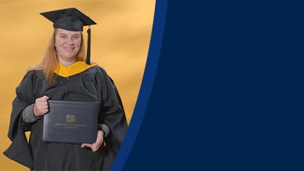 AnnMarie Kulis, an SNHU graduate with a bachelor's in general studies and master's in healthcare administration, wearing a graduation cap and gown.