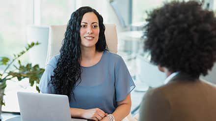 Two business professionals discussing what degree is needed for human resources