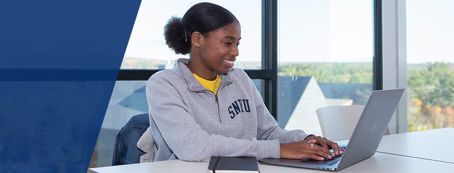 A student studying for her general education classes in college.