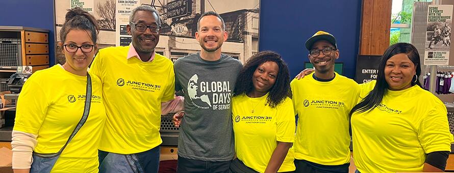 Six volunteers supporting the Charlotte RaceFest Packet Pickup project for SNHU’s Global Days of Service.