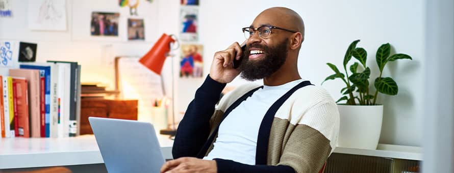 A man is on the phone helping students find their career and life direction