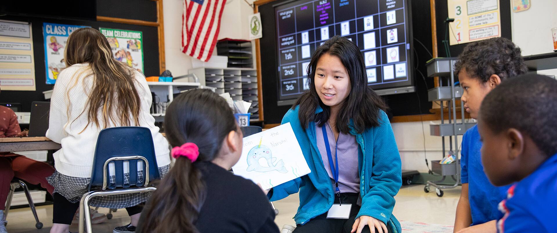 MeD Student Faculty teaching Elementary School Students in the classroom.