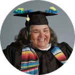 Heather Schey, a Rhode Island resident and SNHU graduate, wearing her cap and gown.