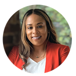 Dr. Jolivette Wallace, SNHU associate dean, wearing a white blouse and red jacket.