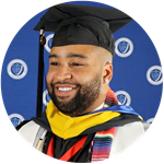 Luis Polanco, who earned his SNHU degree in 2023 and lives New Jersey wearing his cap and gown.